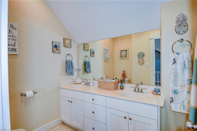 9527 24th Bay St, Norfolk, VA 23518 - bathroom featuring toilet, lofted ceiling, double vanity, and tile patterned flooring