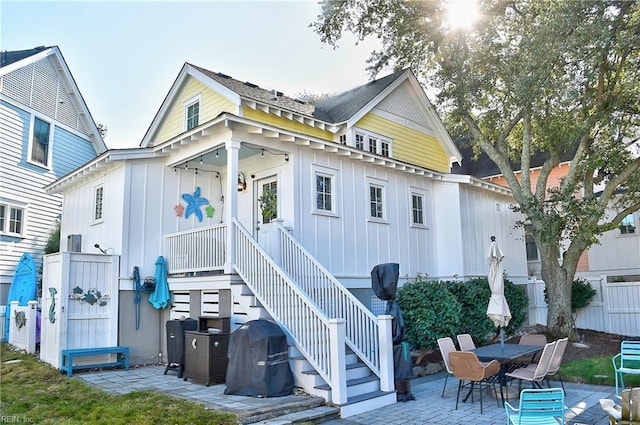 9527 24th Bay St, Norfolk, VA 23518 - back of property featuring fence, a patio, board and batten siding, and a gate