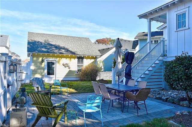 9527 24th Bay St, Norfolk, VA 23518 - view of patio featuring fence, outdoor dining area, and stairs