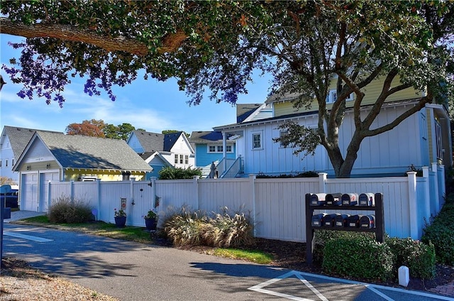 9527 24th Bay St, Norfolk, VA 23518 - view of front of home featuring board and batten siding and a detached garage