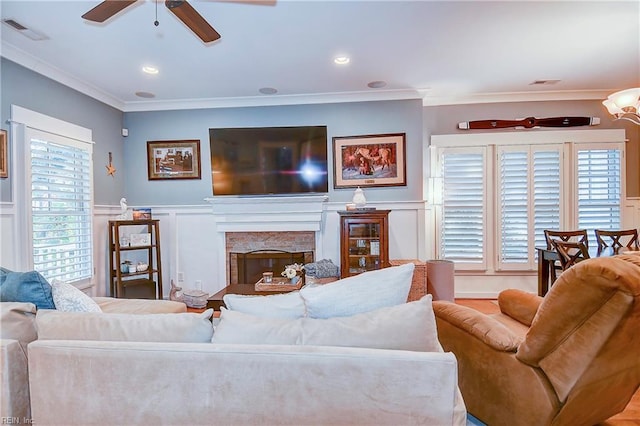 9527 24th Bay St, Norfolk, VA 23518 - living room with ceiling fan, ornamental molding, a decorative wall, a premium fireplace, and a wainscoted wall