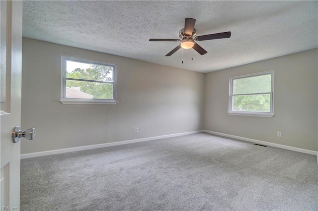 913 Fluvanna Rd, Newport News, VA 23601 - empty room featuring healthy amount of natural light, baseboards, a textured ceiling, carpet floors, and a ceiling fan
