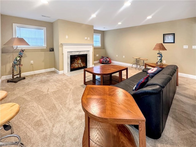 564 Riverside Dr, Lancaster, VA 22503 - living room with light colored carpet, a high end fireplace, baseboards, and recessed lighting