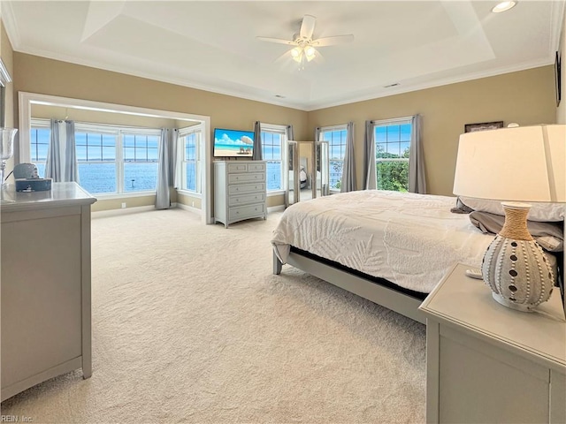 564 Riverside Dr, Lancaster, VA 22503 - bedroom with a tray ceiling, light colored carpet, ornamental molding, baseboards, and a ceiling fan