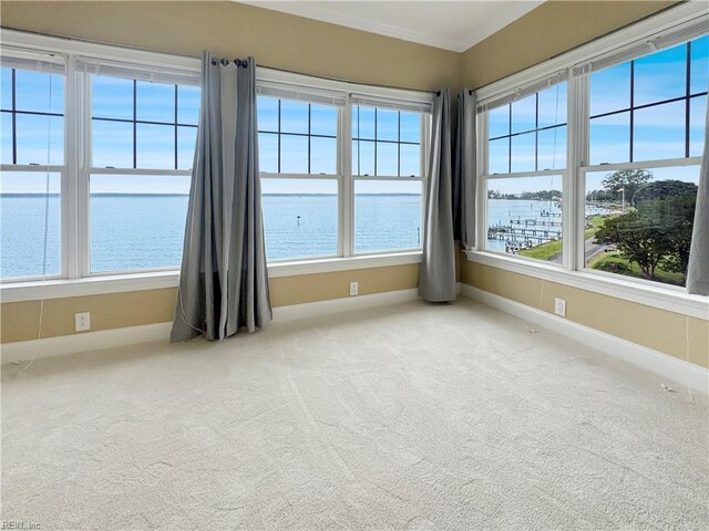 564 Riverside Dr, Lancaster, VA 22503 - empty room with baseboards, a water view, and carpet floors