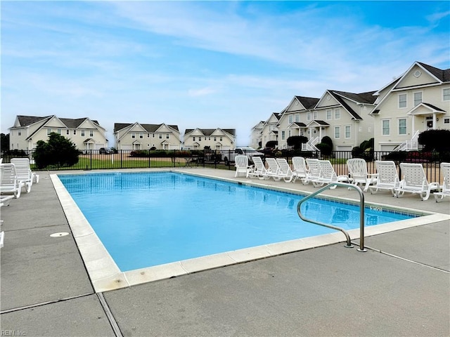 564 Riverside Dr, Lancaster, VA 22503 - community pool with a residential view, fence, and a patio