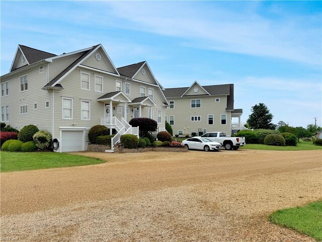 564 Riverside Dr, Lancaster, VA 22503 - view of front of home with a garage and a front lawn
