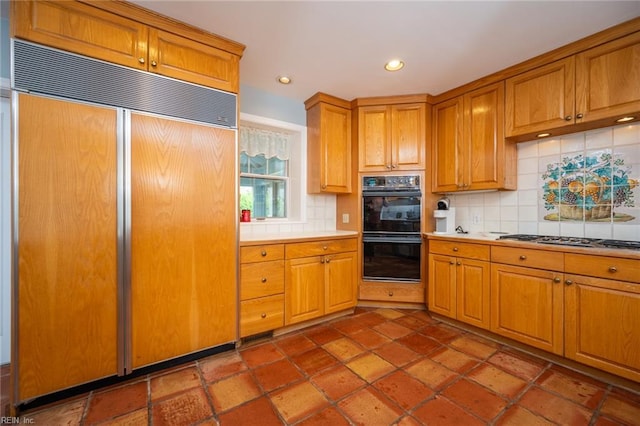 502 Pembroke Ave, Norfolk, VA 23507 - kitchen with paneled built in fridge, stainless steel gas stovetop, decorative backsplash, light countertops, and recessed lighting