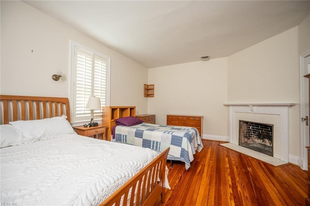 502 Pembroke Ave, Norfolk, VA 23507 - bedroom with wood finished floors, a fireplace, and baseboards