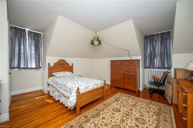 502 Pembroke Ave, Norfolk, VA 23507 - bedroom featuring radiator, wood finished floors, baseboards, and vaulted ceiling