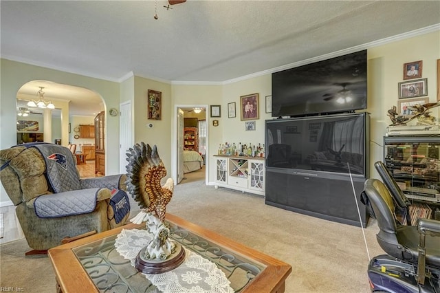 10402 Freewelcome Ln, Gloucester, VA 23061 - living room featuring arched walkways, carpet, crown molding, a textured ceiling, and a chandelier