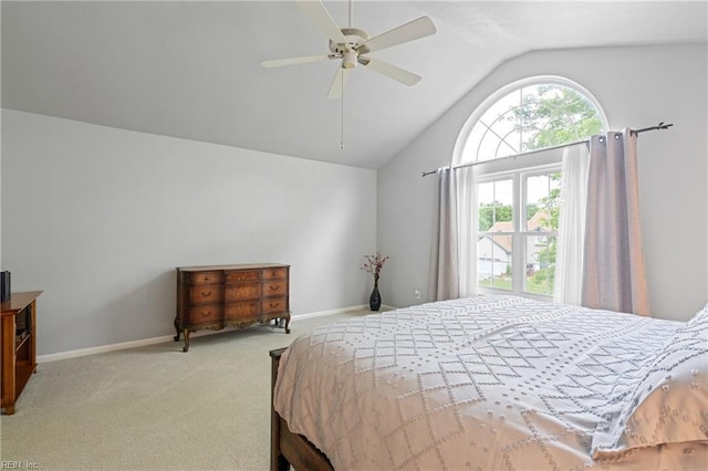 bedroom featuring vaulted ceiling, carpet floors, baseboards, and a ceiling fan