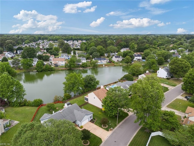 aerial perspective of suburban area with a nearby body of water