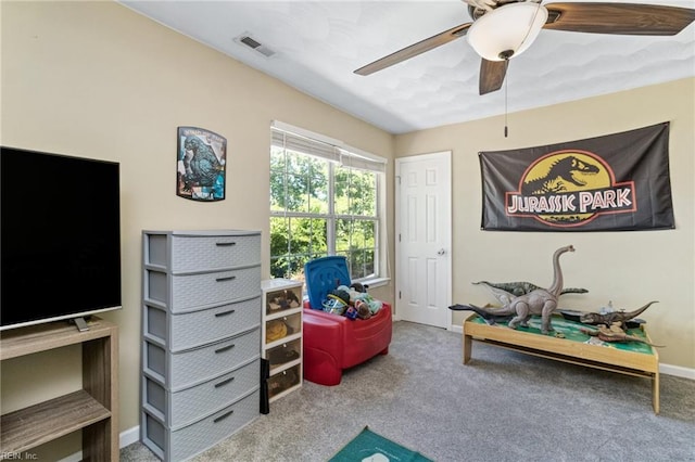 playroom with ceiling fan, carpet flooring, and baseboards