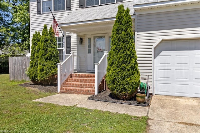 view of exterior entry with an attached garage