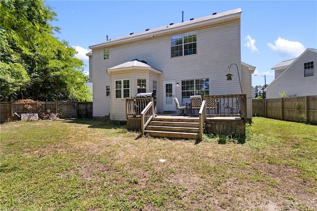 rear view of house with a deck
