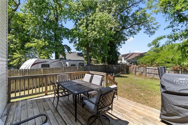 deck featuring outdoor dining area