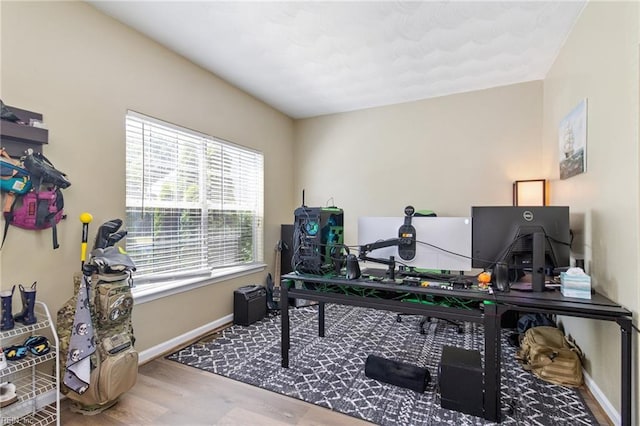 office area with wood finished floors and baseboards