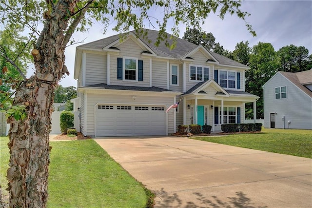 6884 Emerson Ln, Hayes, VA 23072 - view of front of home featuring driveway, a porch, a garage, and a front yard