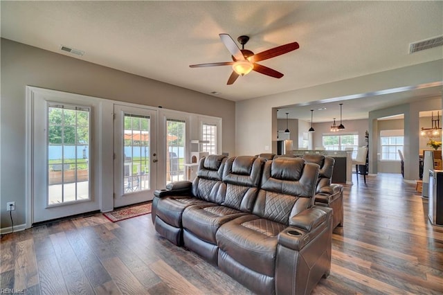 6884 Emerson Ln, Hayes, VA 23072 - living area featuring dark wood-style floors, ceiling fan, french doors, and baseboards