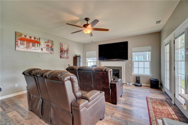 6884 Emerson Ln, Hayes, VA 23072 - living room featuring a ceiling fan, wood finished floors, a fireplace, and baseboards
