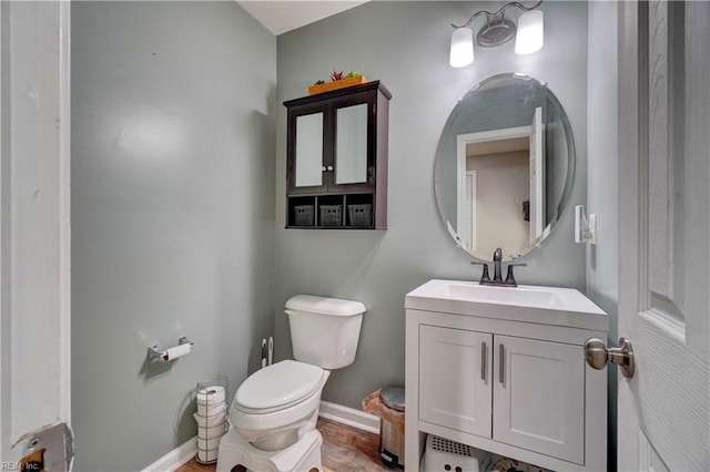 6884 Emerson Ln, Hayes, VA 23072 - bathroom featuring toilet, baseboards, and vanity