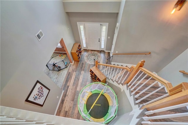 6884 Emerson Ln, Hayes, VA 23072 - stairway featuring wood finished floors and a towering ceiling