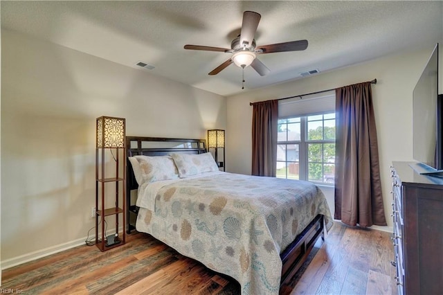 6884 Emerson Ln, Hayes, VA 23072 - bedroom with wood finished floors, baseboards, and a ceiling fan
