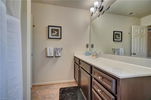 6884 Emerson Ln, Hayes, VA 23072 - bathroom featuring vanity, baseboards, and a shower with curtain