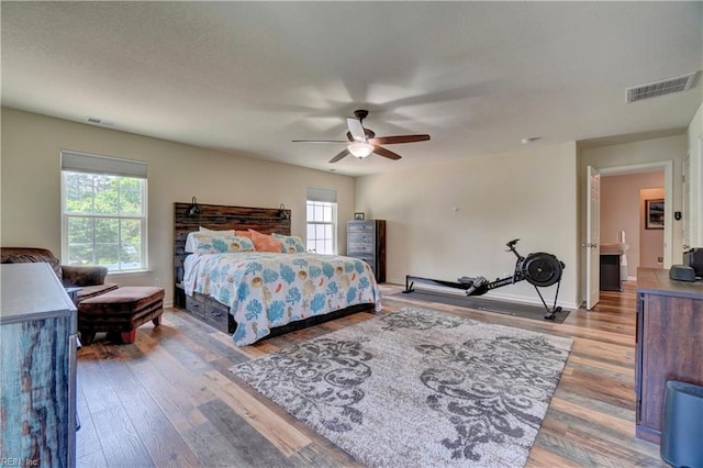 6884 Emerson Ln, Hayes, VA 23072 - bedroom with wood finished floors, a ceiling fan, and baseboards