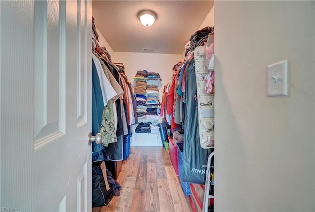 6884 Emerson Ln, Hayes, VA 23072 - spacious closet with wood finished floors