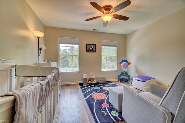 6884 Emerson Ln, Hayes, VA 23072 - sitting room featuring wood finished floors, a ceiling fan, and baseboards