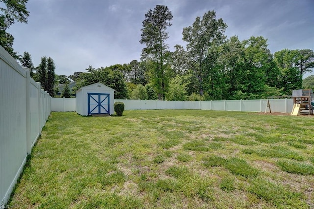 6884 Emerson Ln, Hayes, VA 23072 - view of yard featuring a storage unit, an outdoor structure, and a playground