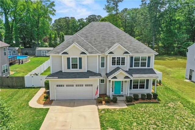 6884 Emerson Ln, Hayes, VA 23072 - view of front of home with concrete driveway, an attached garage, and roof with shingles