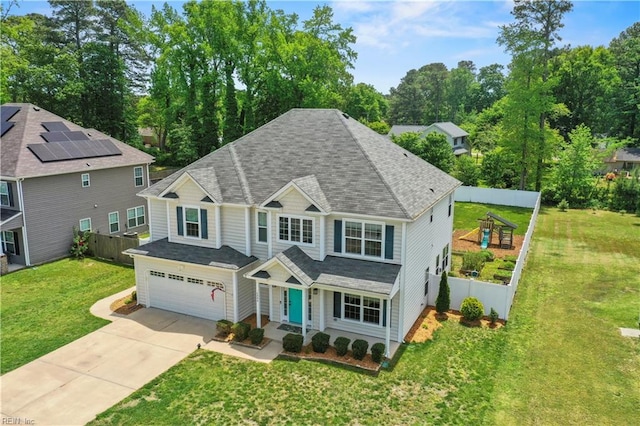 6884 Emerson Ln, Hayes, VA 23072 - view of front of house featuring a garage, concrete driveway, roof with shingles, and view of scattered trees