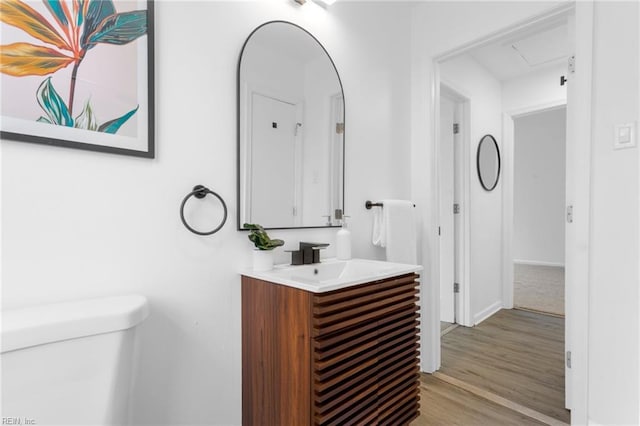 1304 Woodcrest Dr, Hampton, VA 23663 - half bathroom with toilet, vanity, wood finished floors, and baseboards