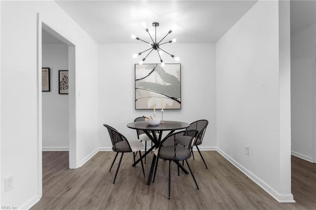 1304 Woodcrest Dr, Hampton, VA 23663 - dining space with wood finished floors, a chandelier, and baseboards