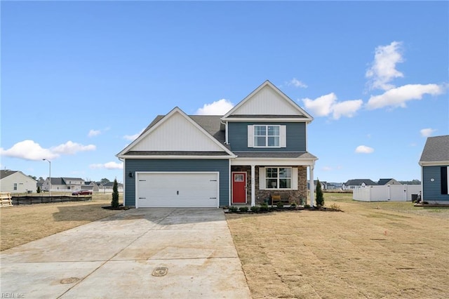 303 Mizzen Way, Elizabeth City, NC 27909 - view of front of house with concrete driveway, an attached garage, and board and batten siding