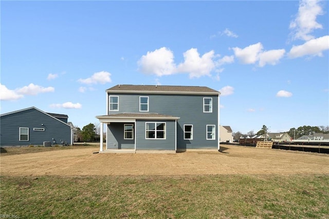 303 Mizzen Way, Elizabeth City, NC 27909 - back of house featuring a lawn