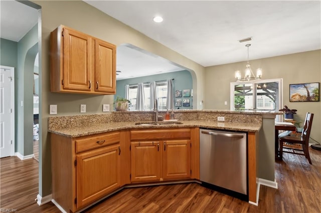 825 Wyemouth Dr, Newport News, VA 23602 - kitchen with dishwasher, dark wood finished floors, a sink, arched walkways, and light stone counters