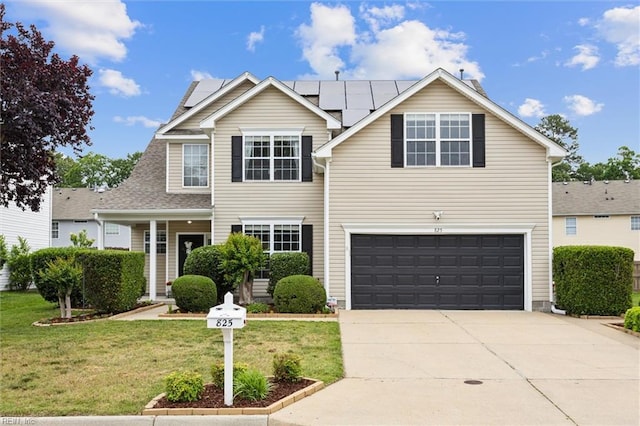 825 Wyemouth Dr, Newport News, VA 23602 - traditional home with a front lawn, a garage, roof mounted solar panels, and concrete driveway