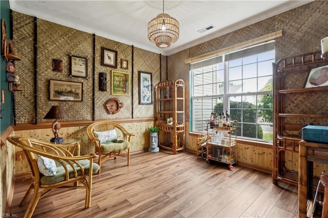 825 Wyemouth Dr, Newport News, VA 23602 - sitting room with wood finished floors, plenty of natural light, crown molding, wallpapered walls, and baseboards