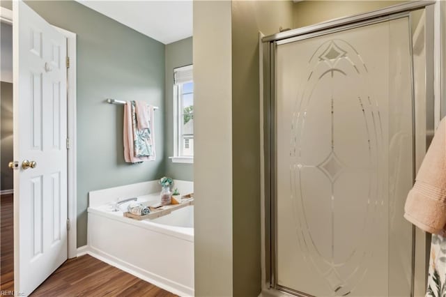 825 Wyemouth Dr, Newport News, VA 23602 - bathroom with a shower stall, wood finished floors, a bath, and baseboards