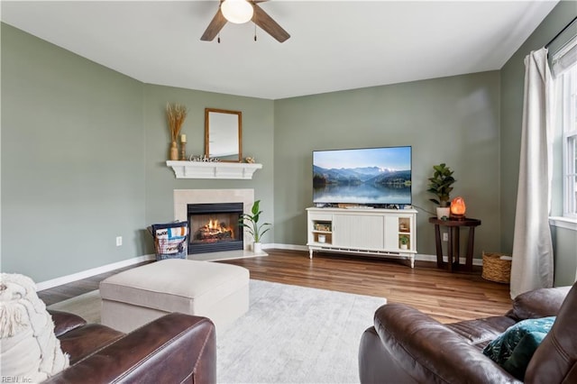 825 Wyemouth Dr, Newport News, VA 23602 - living area featuring a ceiling fan, wood finished floors, a warm lit fireplace, and baseboards