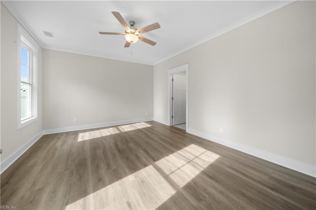 2094 Asher Dr, Suffolk, VA 23435 - spare room featuring a ceiling fan, baseboards, wood finished floors, and crown molding