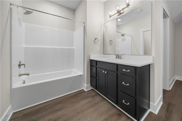 2094 Asher Dr, Suffolk, VA 23435 - bathroom featuring wood finished floors, shower / bath combination, baseboards, and vanity