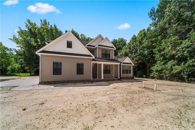 5376 Kenmere Ln, Smithfield, VA 23430 - rear view of house with board and batten siding, covered porch, a standing seam roof, and metal roof