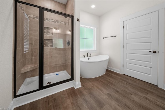 5376 Kenmere Ln, Smithfield, VA 23430 - bathroom featuring a shower stall, a soaking tub, wood finished floors, baseboards, and recessed lighting