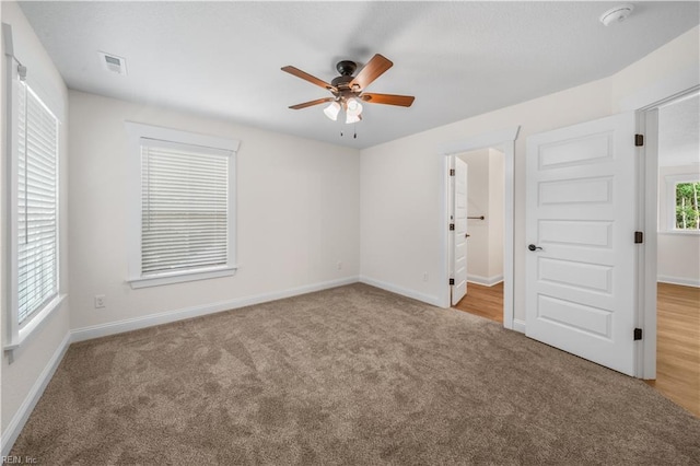 5376 Kenmere Ln, Smithfield, VA 23430 - unfurnished bedroom with carpet floors, baseboards, and ceiling fan