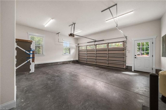 5376 Kenmere Ln, Smithfield, VA 23430 - garage with a garage door opener and baseboards